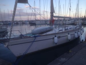 sun odyssey sailboat in water before renovation